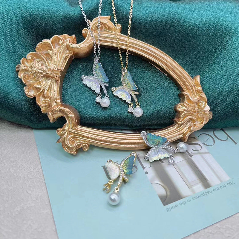 2 Schmetterlings-Charm-Anhänger mit Strass-Muschel, verziert aus 14-karätigem GF