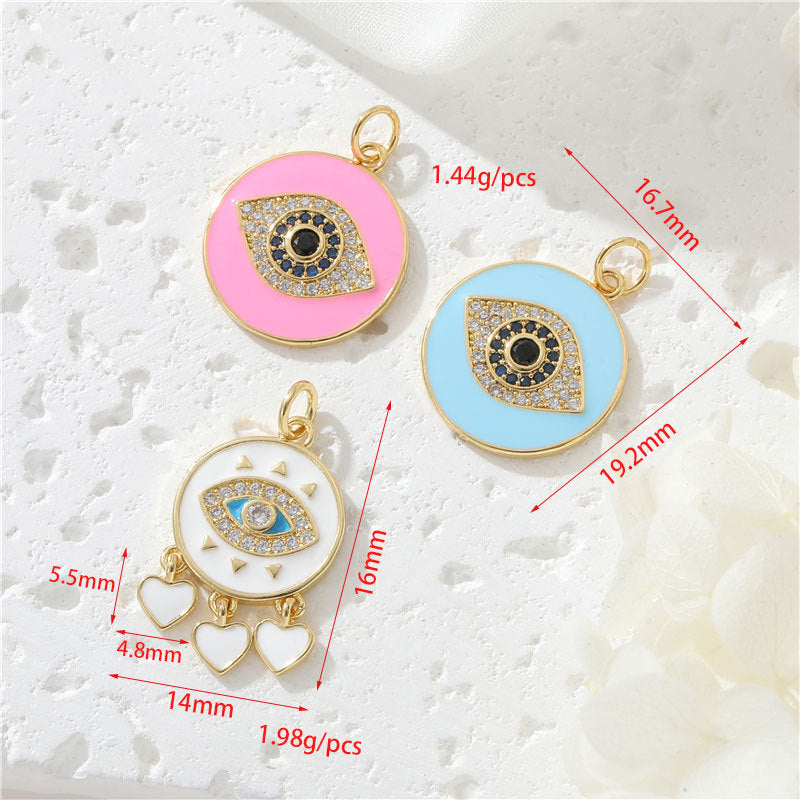 Pendentif de charme à 2 yeux émail époxy strass embelli 14K GF