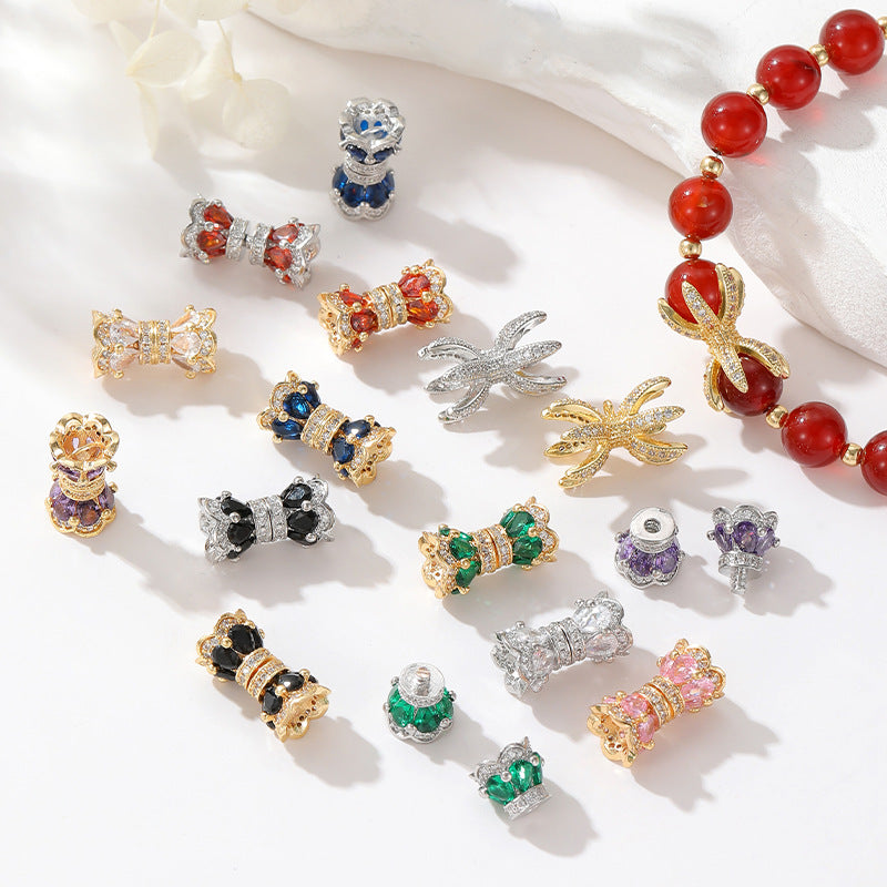 2 fermoirs à vis floraux ornés de strass 14K GF