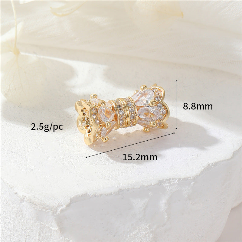 2 fermoirs à vis floraux ornés de strass 14K GF