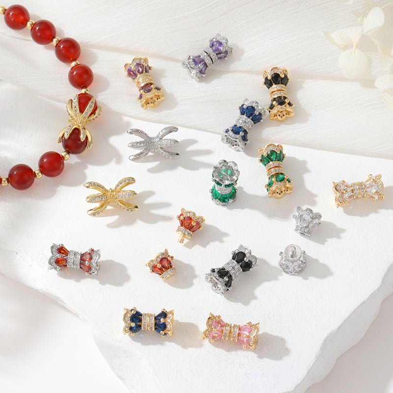 2 fermoirs à vis floraux ornés de strass 14K GF