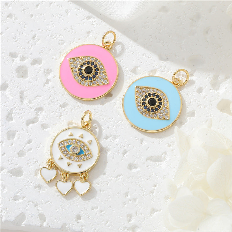 Pendentif de charme à 2 yeux émail époxy strass embelli 14K GF