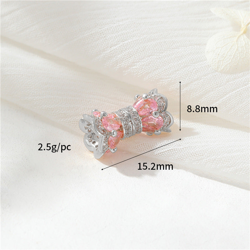 2 fermoirs à vis floraux ornés de strass 14K GF