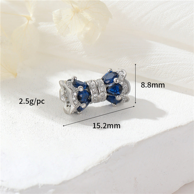 2 fermoirs à vis floraux ornés de strass 14K GF