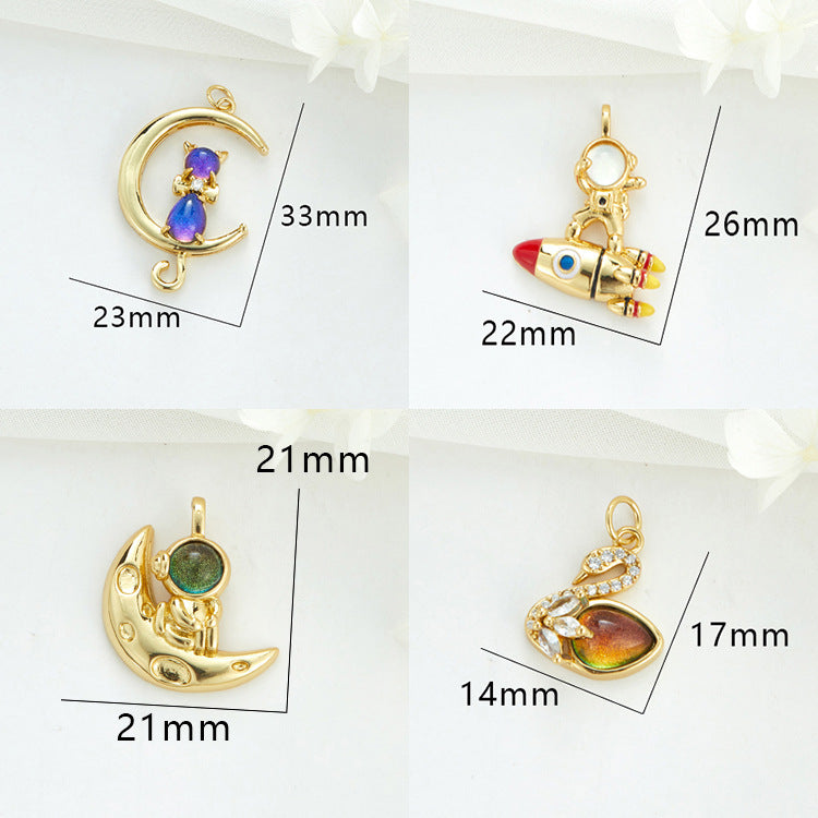 2 Cateye-Steine, Astronaut auf Mond, Rakete, Schwan, Katze, Charm-Anhänger, Harz, Strass, verziert, 14 K GF