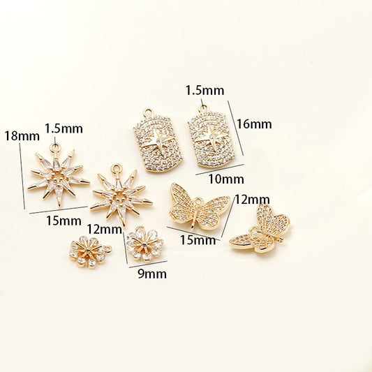 2-Sterne-Charm-Anhänger mit Blumen- und Schmetterlingsmotiv, mit Strasssteinen verziert, 14 Karat GF