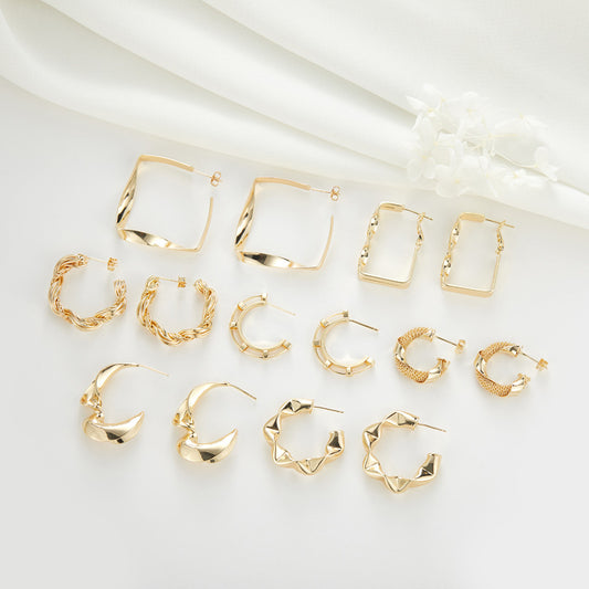 4 gezwirnte, runde, klobige Creolen aus 14-karätigem GF