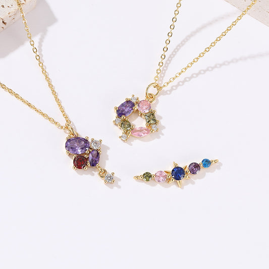 2 Blumen-Kreis-Stern-Charm-Anhänger mit Strassverzierung aus 14-karätigem GF