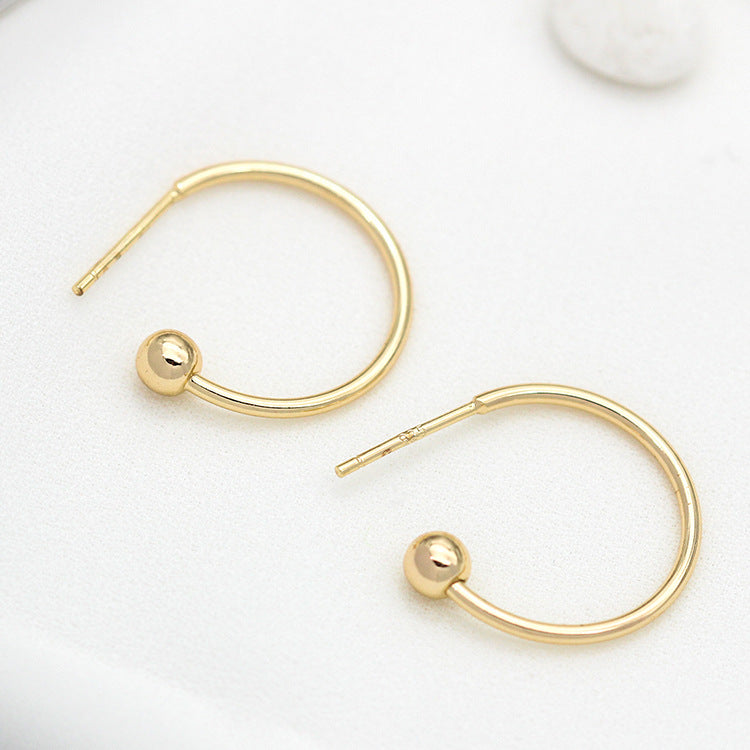 10 Ohrstecker mit runden Perlenenden, 14 Karat GF