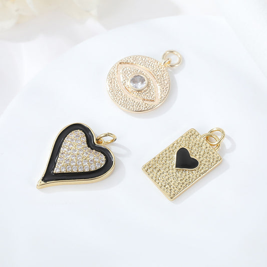 Pendentif à breloque cœur à 2 yeux orné de strass 14K GF