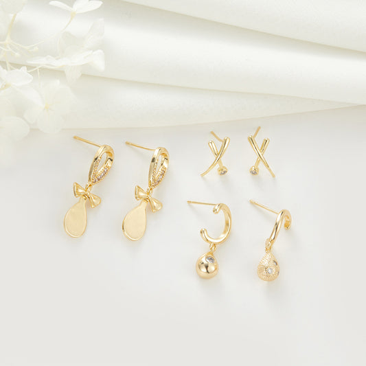 4 Ohrstecker mit Schleife und Kreuz, 14 K GF, mit Strasssteinen verziert