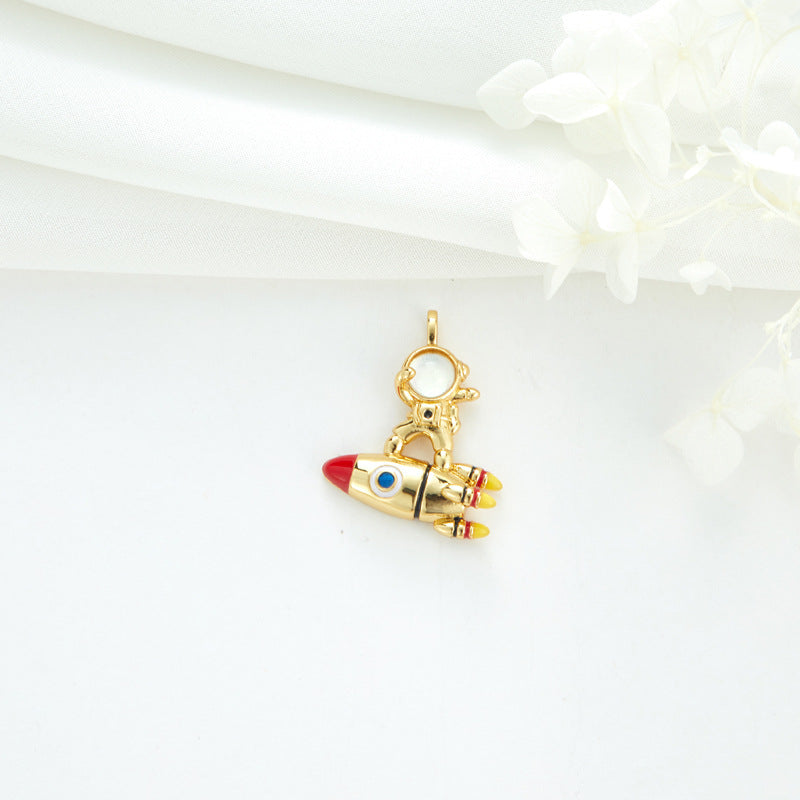 2 Cateye-Steine, Astronaut auf Mond, Rakete, Schwan, Katze, Charm-Anhänger, Harz, Strass, verziert, 14 K GF