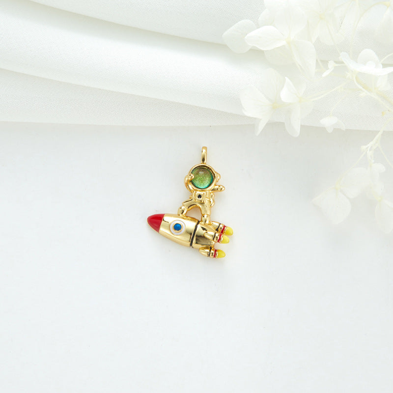 2 Cateye-Steine, Astronaut auf Mond, Rakete, Schwan, Katze, Charm-Anhänger, Harz, Strass, verziert, 14 K GF