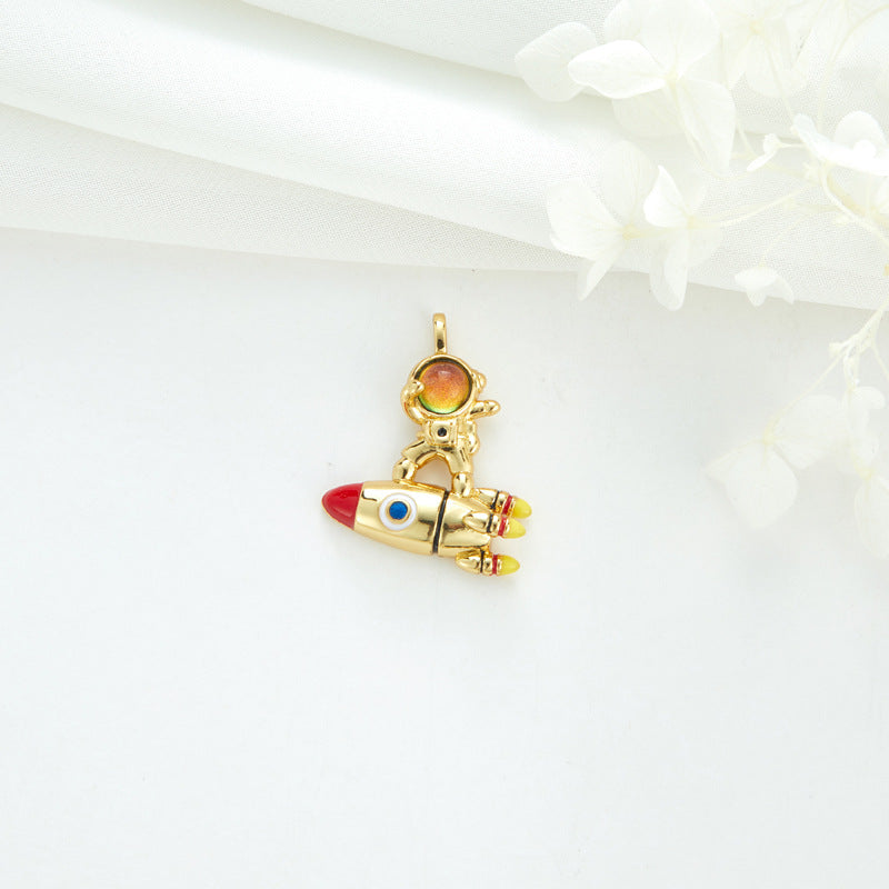 2 Cateye-Steine, Astronaut auf Mond, Rakete, Schwan, Katze, Charm-Anhänger, Harz, Strass, verziert, 14 K GF